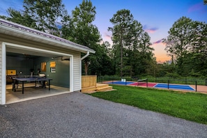 A building with a ping pong table and a tennis court. - Mtn Views, Pickleball Court, Hot Tub & Fire Pit (Arden)