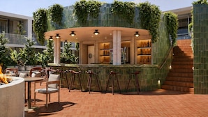 A bar area with a circular seating arrangement, a fire pit, and a staircase leading to an upper level. - Sítio El Tropicano (San Antonio)
