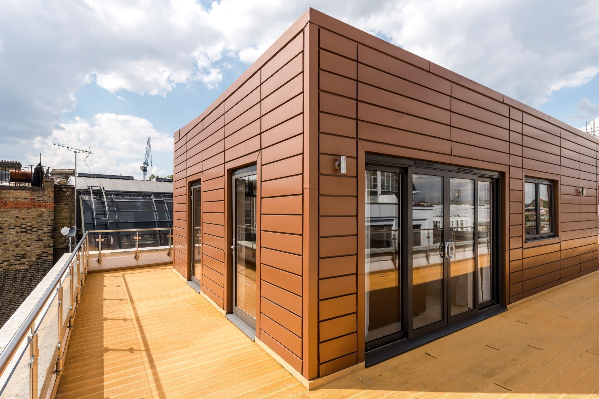 A modern building with a flat roof and large windows.