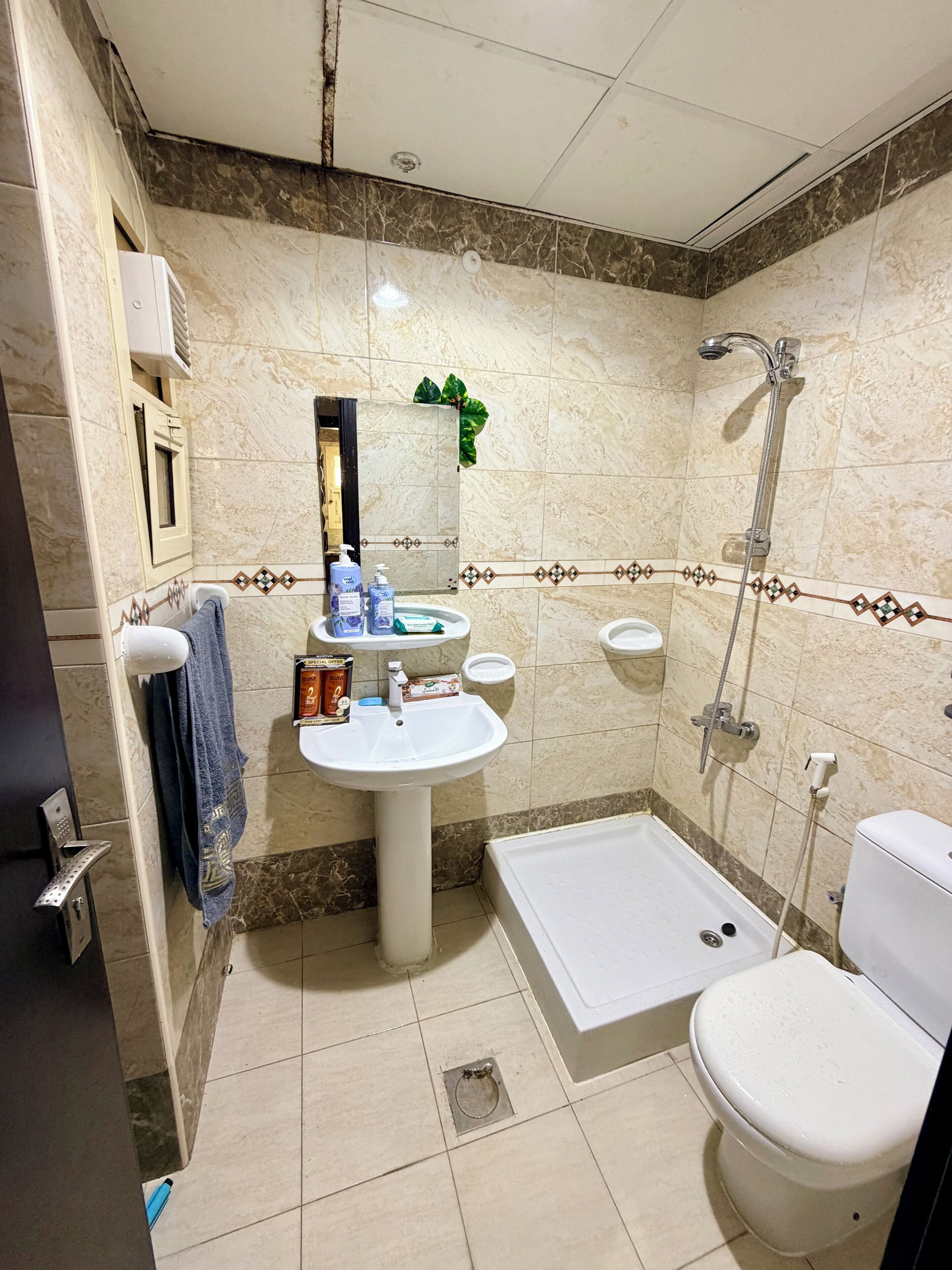 Shower, hair dryer, towels, soap