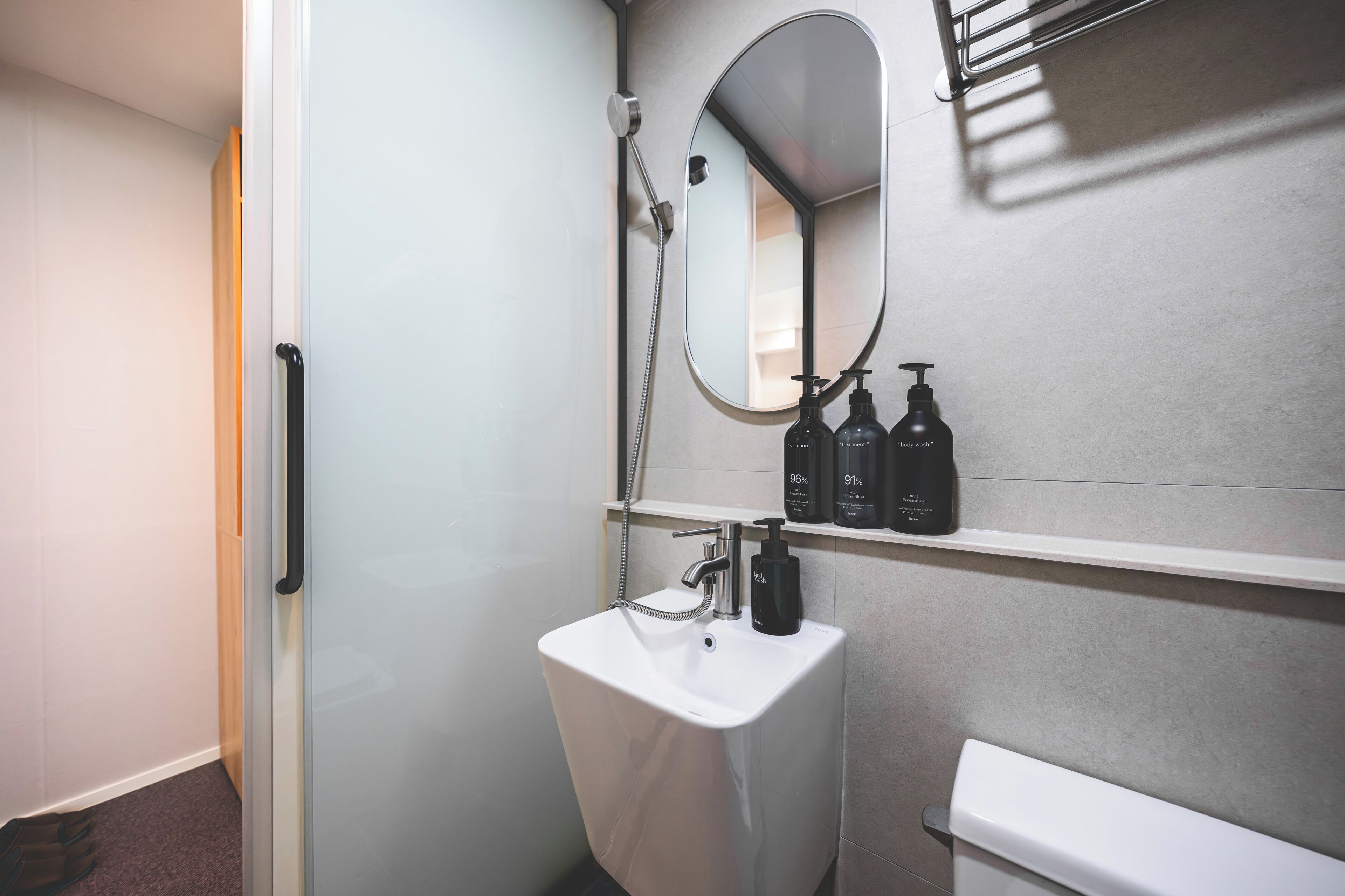 Shower, hair dryer, slippers, towels