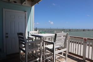 Outdoor dining - 3-bedroom town home on the water with a pool, fishing pier, boat ramp!!!! (Rockport)