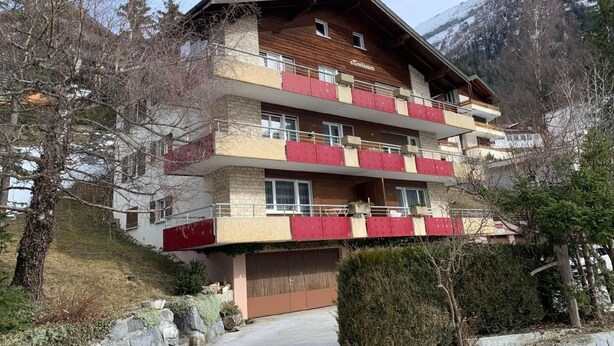 A multi-story building with balconies, set in a mountainous area. - Haus Montanara by Interhome (Leukerbad)