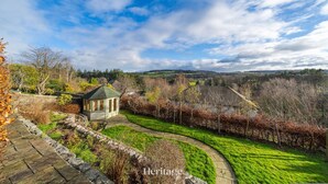 A garden with a gazebo, stone pathway, and a view of the countryside. - Killiegowan Self-catering Holiday Home in Aberdeen (Aberdeen)