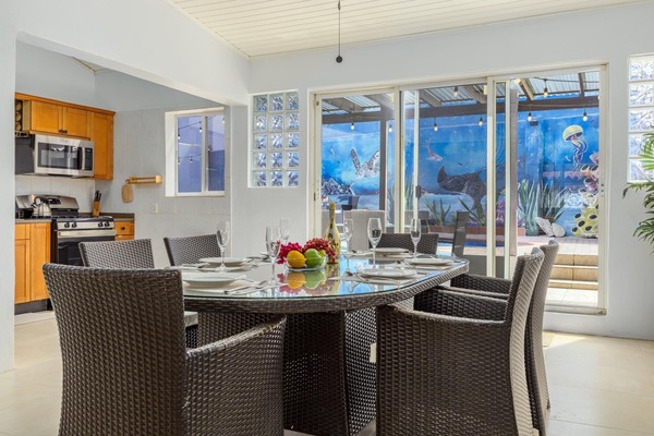 Gather around the dining table for six, perfectly positioned beside the kitchen for effortless serving and memorable shared meals.