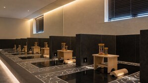 A modern bathroom with multiple sinks, wooden stools, and hourglasses. - Loop Seoul Hotel by Anook Seoul Gangnam 1 (Seoul)