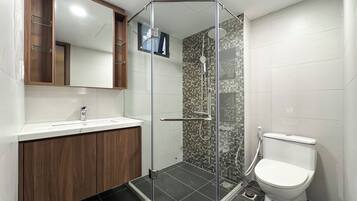 Shower, hair dryer, towels, shampoo