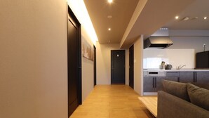 A modern kitchen with a built-in oven, a sink, and a stove.