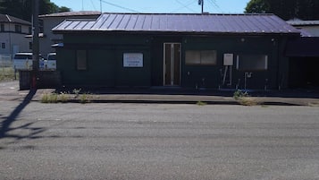 A building with a sign reading 'TOHANA STYLE' on the side.