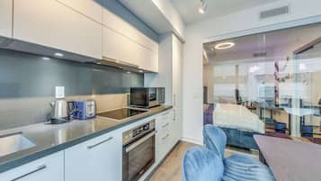 Suíte superluxo, vista para a cidade | Área de estar