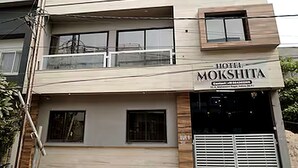 A multi-story building with a sign reading 'HOTEL MOKSHITA.' - Hotel Mokshita (Indore)