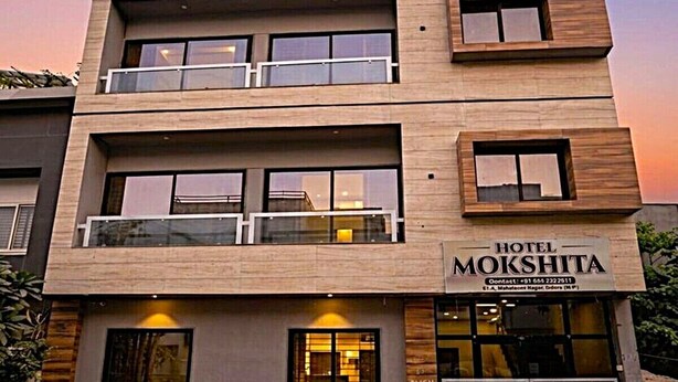 A modern hotel building with a sign reading "HOTEL MOKSHITA." - Hotel Mokshita (Indore)