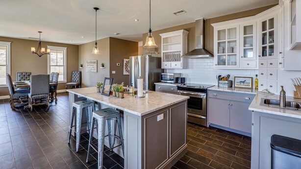A spacious kitchen with a large island, bar stools, and modern appliances. - Peaceful, Serene Getaway 17 Mi to Dtwn Roswell! (Roswell)