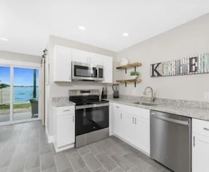 Fridge, microwave, oven, stovetop - Bayfront Condo, Prime Beach Access, Manasota Key (Englewood)