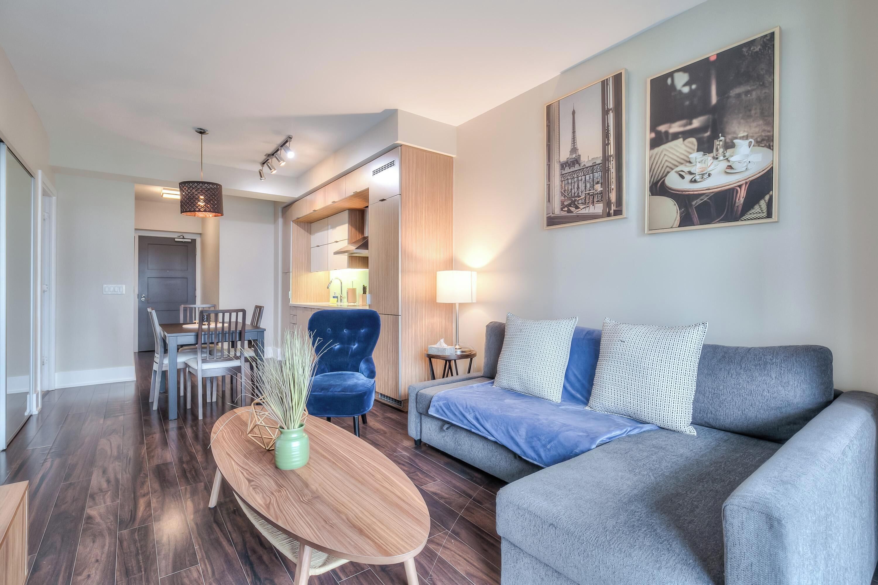 Deluxe Suite, 1 Queen Bed with Sofa bed | Living area | 50-inch flat-screen TV with cable channels