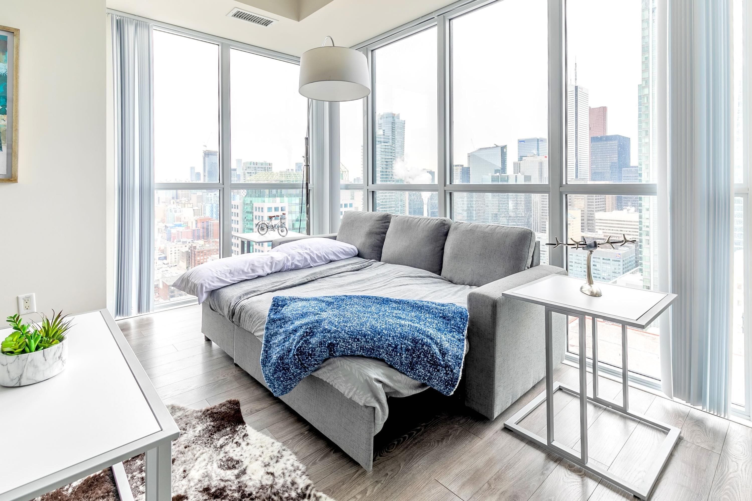 Economy Suite, 1 Queen Bed with Sofa bed | Living area | 50-inch flat-screen TV with cable channels