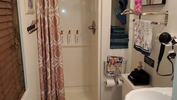 Shower, hair dryer, towels, soap