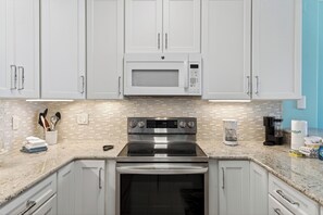Fridge, microwave, oven, stovetop - Gulf-Front Condo + Balcony + Heated Pool + Hot Tub + Sauna | Gulfview Haven (Panama City Beach)