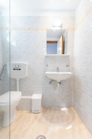 Triple Room with Pool View | Bathroom | Shower, hair dryer, towels, soap