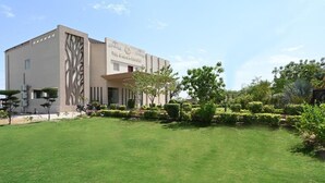 A modern building with a sign reading "The Garden Report". - THE GANGA RESORT (Bikaner)