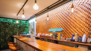 A reception area with a wooden counter, bar stools, and a sign indicating it's the reception and bar.