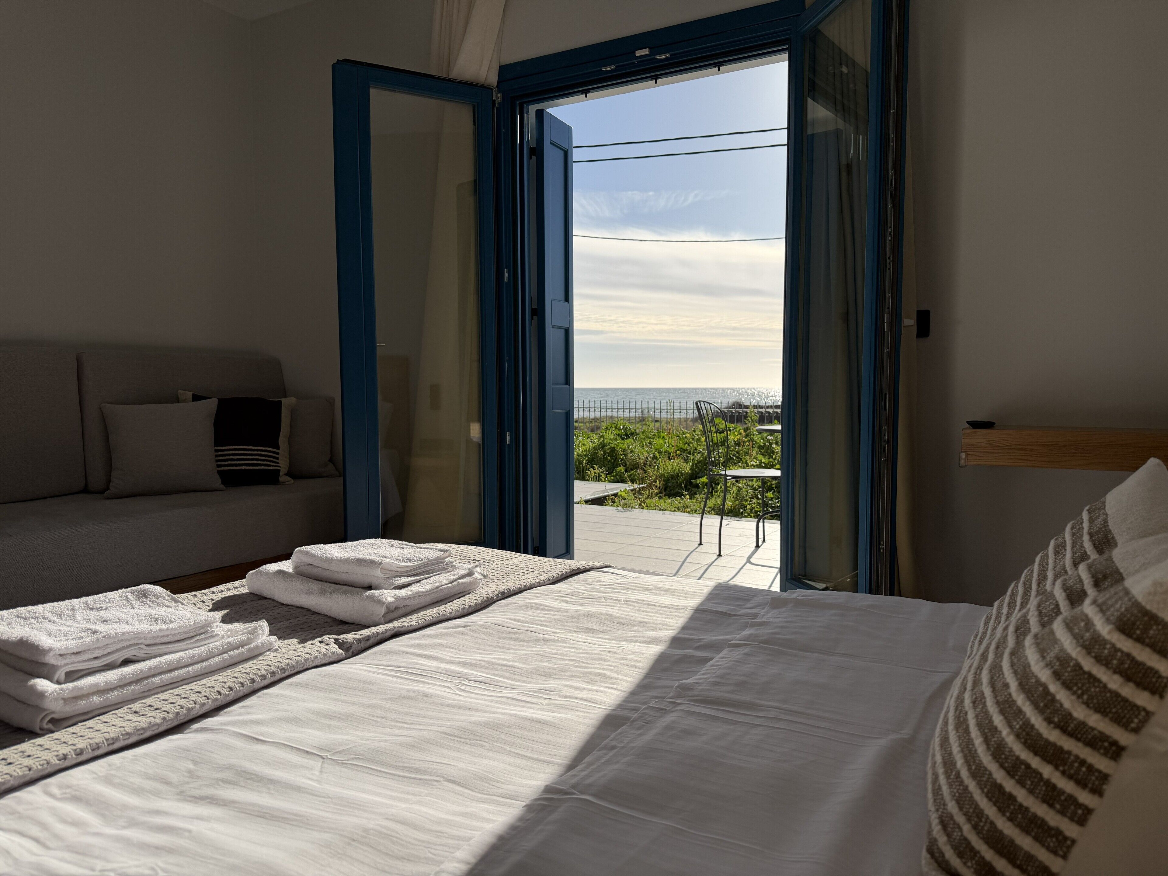 Deluxe Studio, Patio, Sea View | In-room safe, laptop workspace, blackout drapes, iron/ironing board