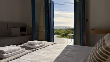 Deluxe Studio, Patio, Sea View | In-room safe, laptop workspace, blackout drapes, iron/ironing board