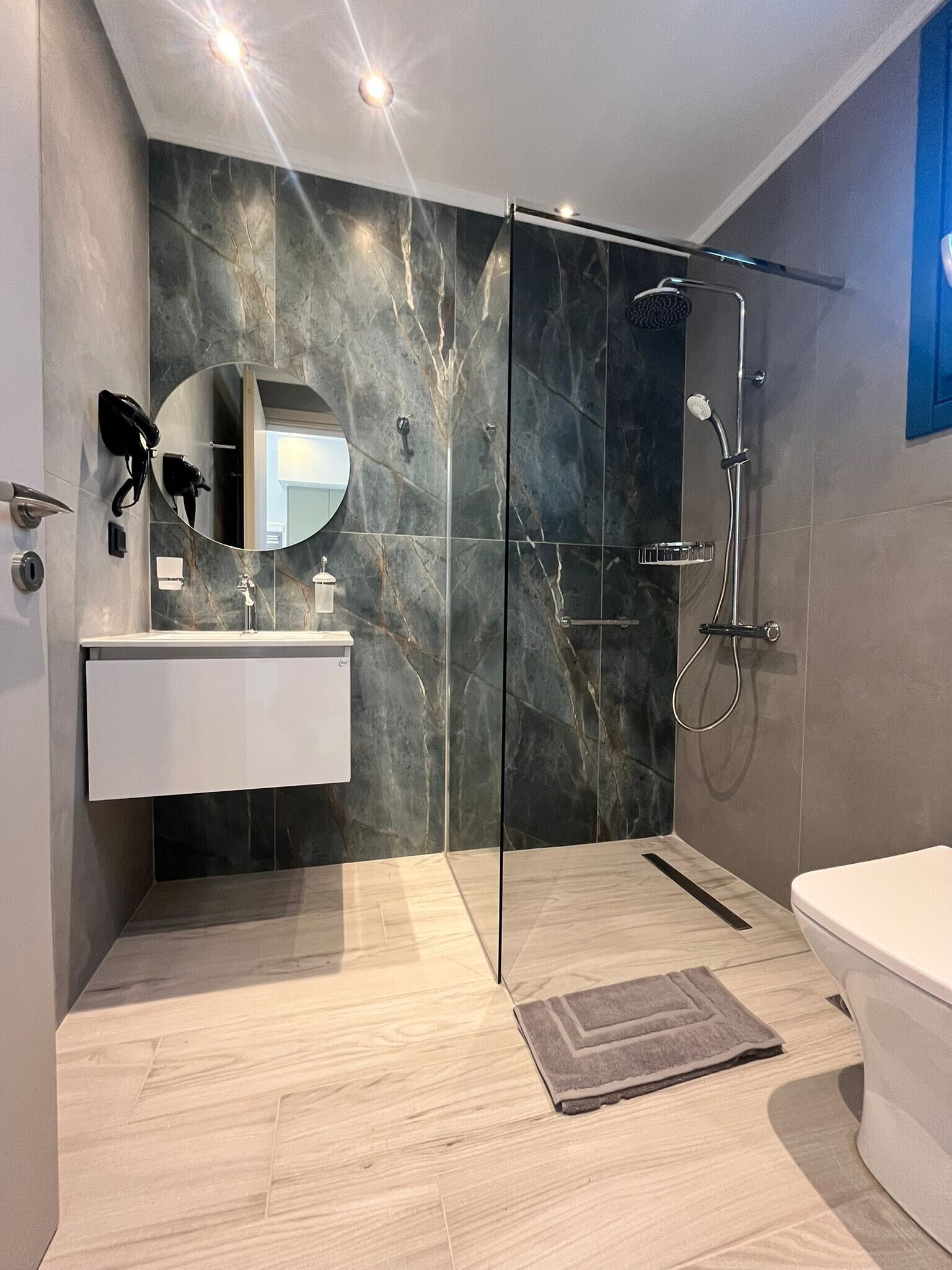 Shower, hair dryer, towels, soap
