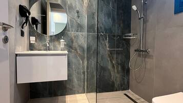Shower, hair dryer, towels, soap