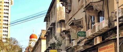 A street with various shops, including a Xerox center and a chemist.