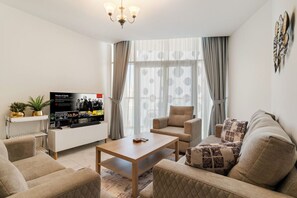 Living area - FIRST CLASS | 1BR | Canal & Burj Khalifa View (Business Bay)