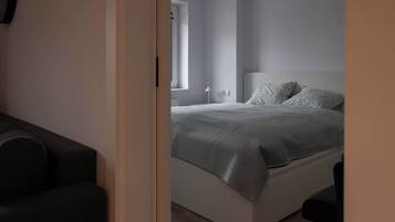 1 bedroom, desk, iron/ironing board, travel crib