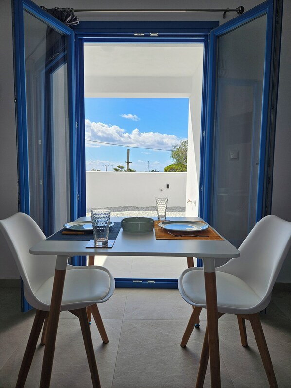 Apartment, 1 Bedroom, Courtyard View, Ground Floor | Dining room - Parian Nissos Harmony Living (Paros)