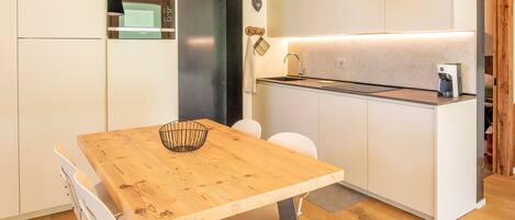 Fridge, dishwasher, coffee/tea maker, cookware/dishes/utensils