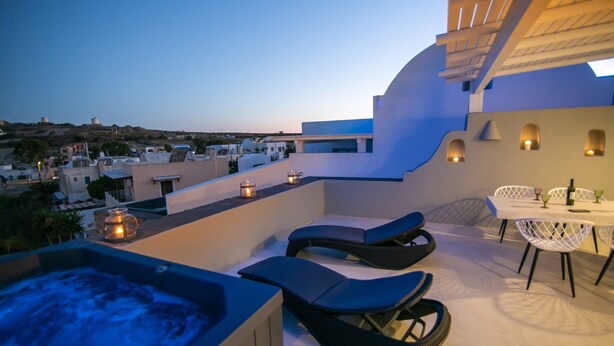A rooftop terrace with a hot tub, lounge chairs, and a dining area with table and chairs. - Villa Ioneira, Sea Views, Outdoor Hot Tub, Furnished Terrace, Santorini (Santorini)