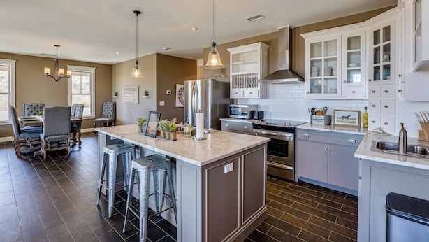 A spacious kitchen with a large island, bar stools, and modern appliances. - Peaceful, Serene Getaway 17 Mi to Dtwn Roswell! (Roswell)
