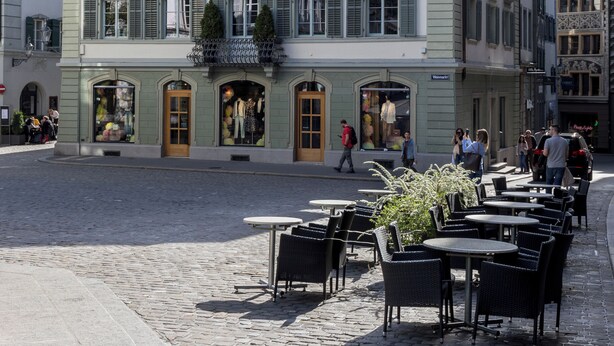 A historic building with a prominent sign for 'HOTEL KRONE,' featuring a classic European architectural style with symmetrical windows and a central entrance. - ODA Suites (Lucerne)
