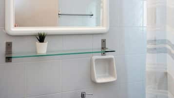 Shower, hair dryer, towels, shampoo