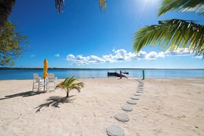 On the beach, sun-loungers, beach towels - Barefoot Kai: Beach House w/Pool, Summer Kitchen, Dock + Kayaks, Steps to Rum Point Club! (Cayman Kai)