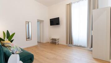 Suite, vistas a la ciudad | Zona de estar