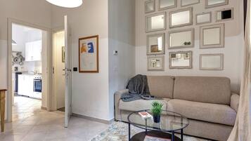 Apartment | Living area | 30-inch flat-screen TV with digital channels