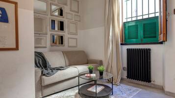 Apartment | Living area | 30-inch flat-screen TV with digital channels