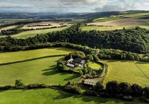Aerial view - A large spacious 3 bedroomed house in farmyard courtyard. (Perth)
