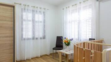 Apartment (One Bedroom Apartment) | Living room | 32-inch flat-screen TV with digital channels