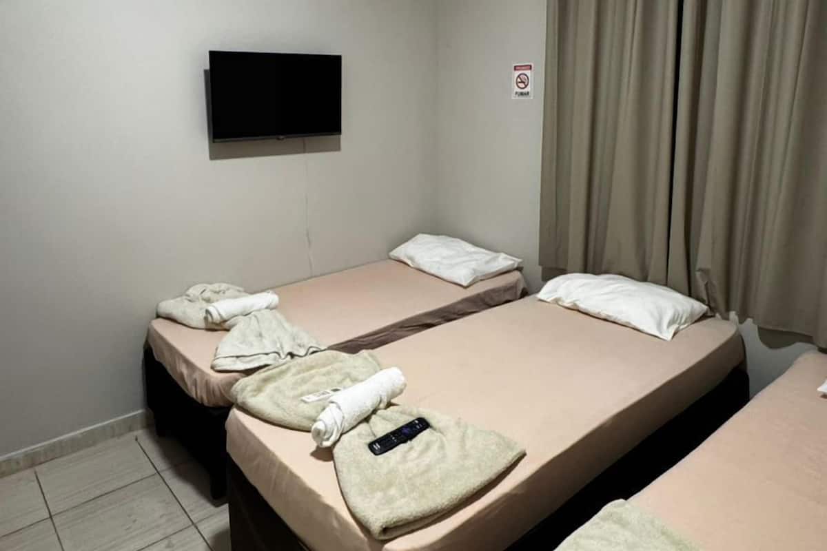 Economy Triple Room, Shared Bathroom | Blackout drapes, iron/ironing board, free WiFi, wheelchair access