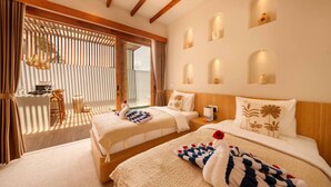 A hotel room with two beds, a dining area, and a balcony with a view. - Stylish 2BR Villa near Central Ubud (Ubud)