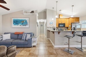 A modern kitchen with a central island, wooden cabinets, and stainless steel appliances. - Pet-Friendly 3BR Home Sleeps 6 Aug7-Sep28 (Panama City Beach)