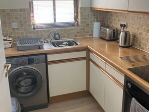 Fridge, microwave, oven, cookware/dishes/utensils - Cedarfell, a ground floor centrally located apartment in Keswick (Keswick)