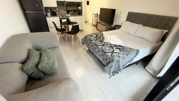 Tabla de planchar con plancha, wifi gratis, ropa de cama