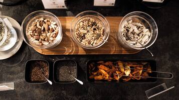 A variety of food items displayed in bowls and containers on a countertop.